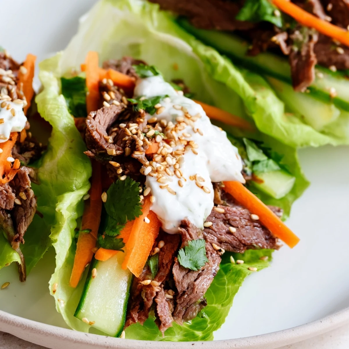 Freshly prepared Beef Wrap with Lettuce filled with tender beef and crunchy veggies, perfect for a quick high protein lunch.