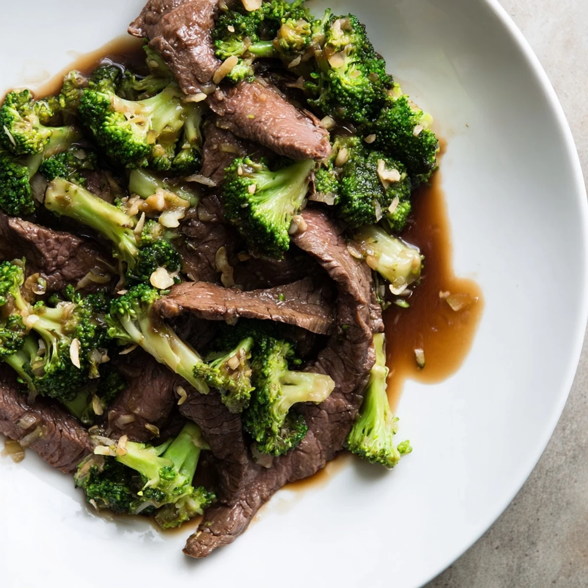 Tender beef strips and bright green broccoli florets coated in a savory garlic soy sauce.