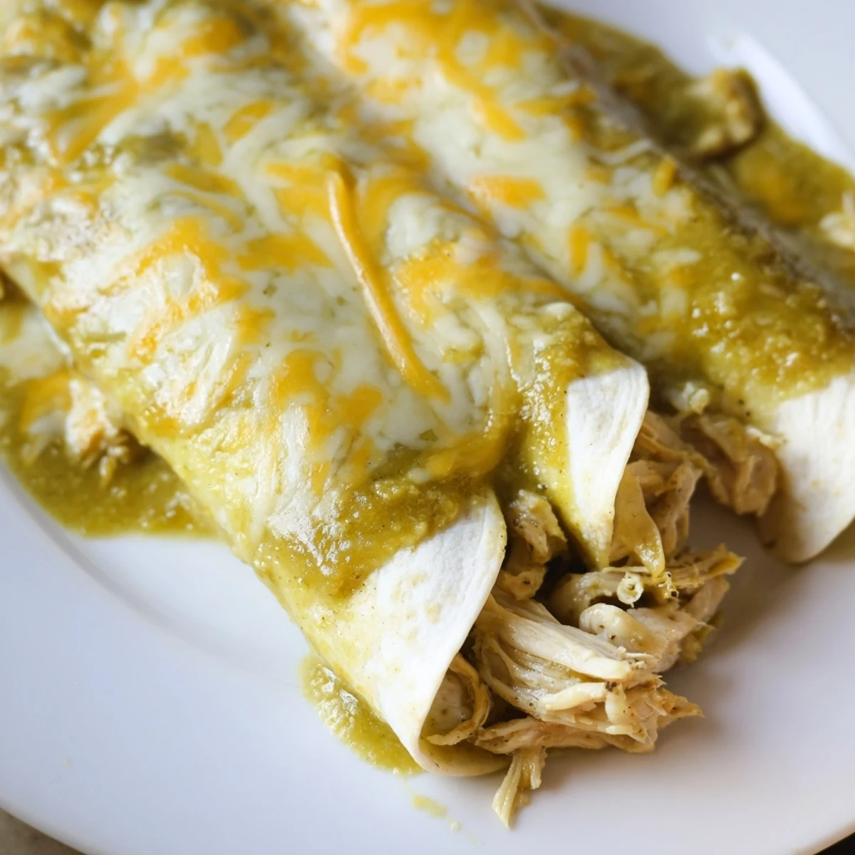 Bubbling hot from the oven, the Green Enchiladas With Chicken feature soft corn tortillas and savory chicken.