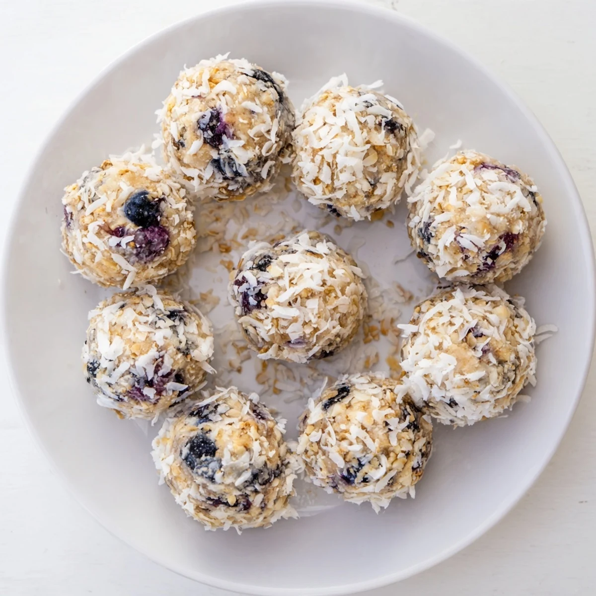 Lemon Blueberry Cottage Cheese Protein Bites in a meal prep container for on-the-go snack.