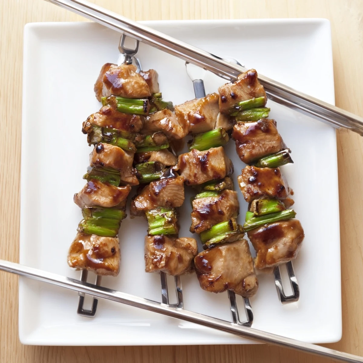 Golden glazed chicken yakitori skewers grilled to perfection with glossy tare sauce coating