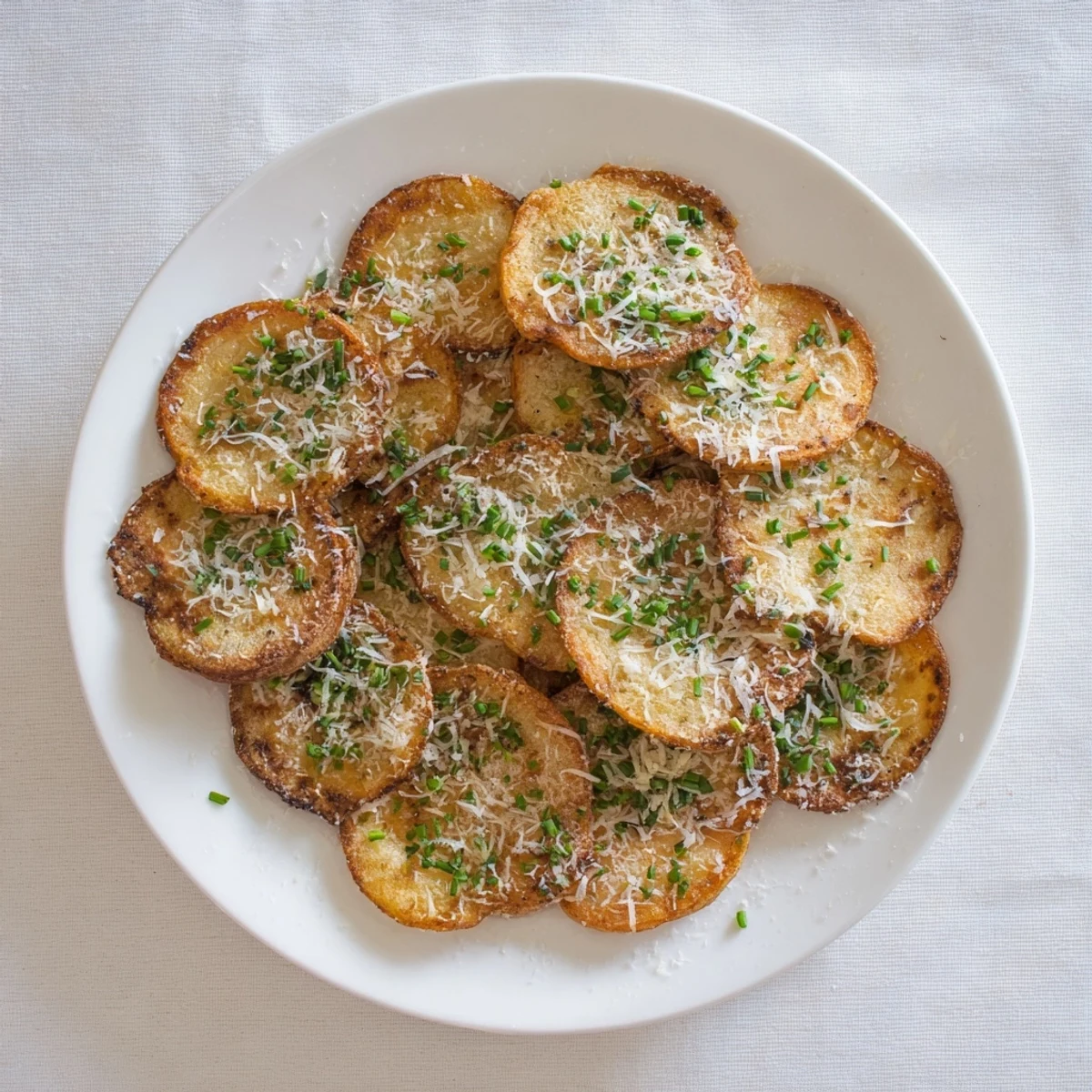 Baked cottage cheese chips showing crispy edges and golden spots on a wooden board