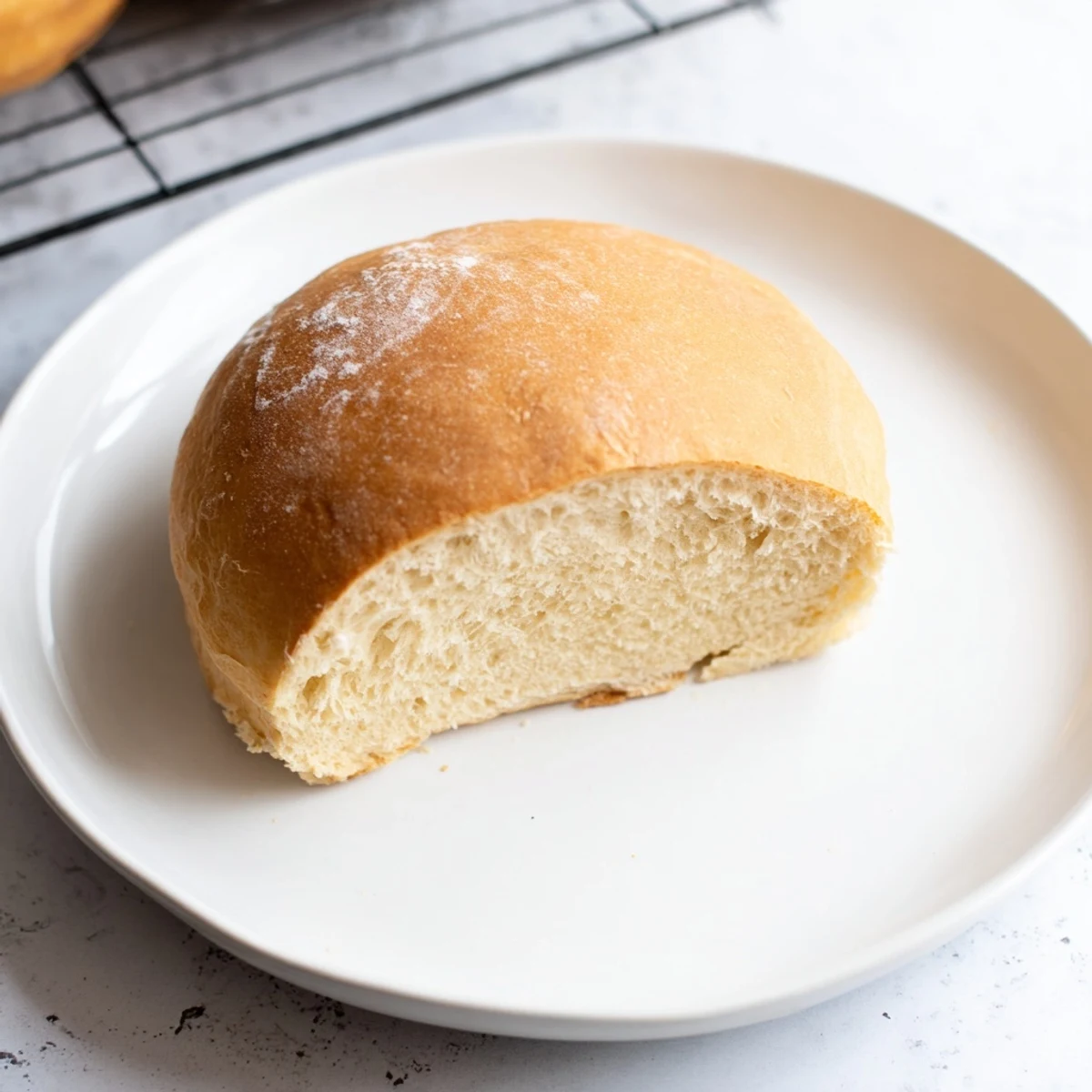 Round no-oven bread loaf with golden brown crust and light airy texture