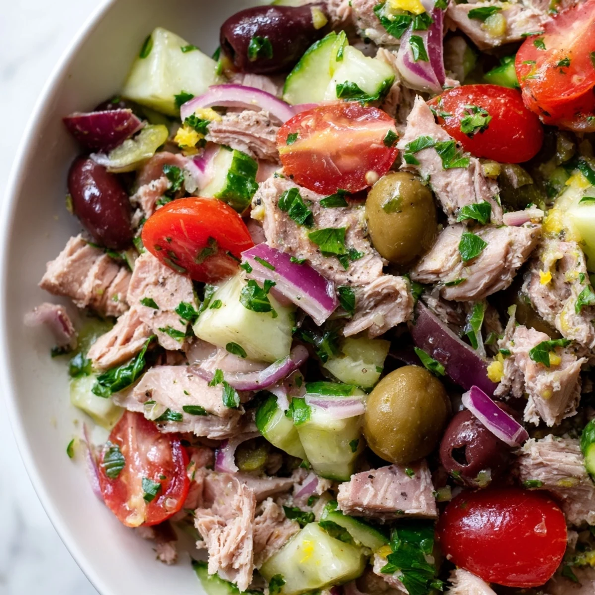 Crisp cucumber and tender tuna tossed in zesty lemon dressing with colorful vegetables