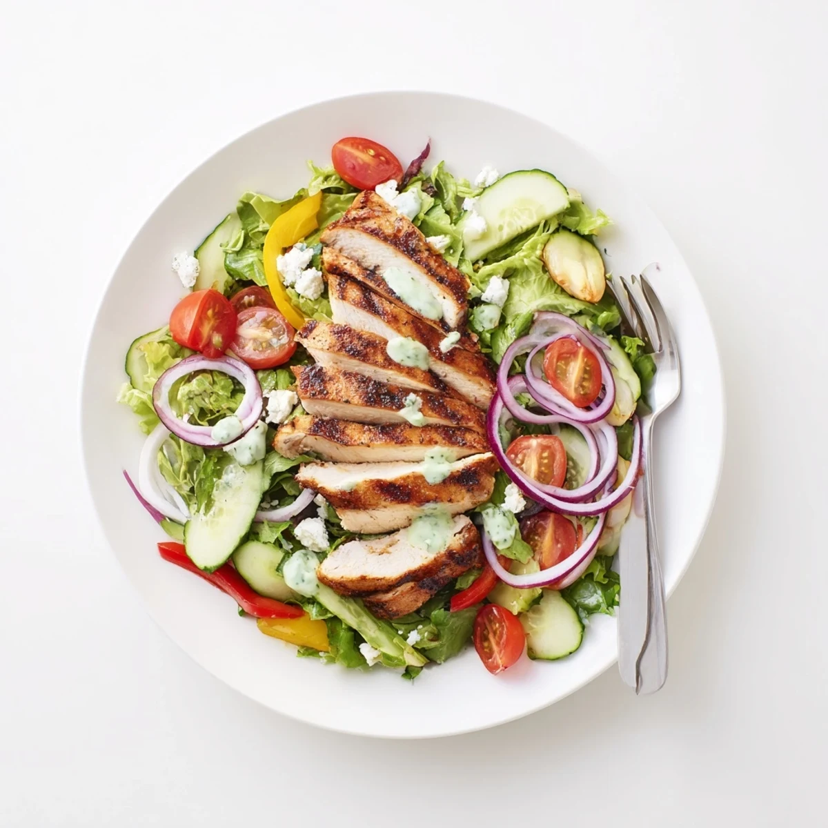 Grilled Chicken Salad Avocado Herb Dressing Recipe with juicy sliced chicken and crisp greens.