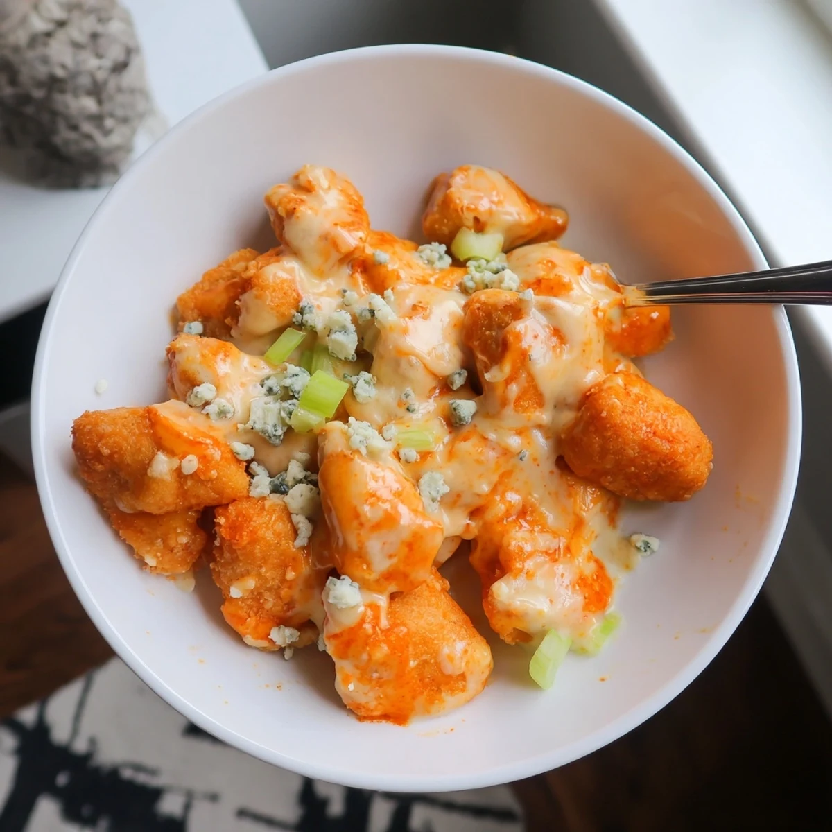 Keto Buffalo Chicken Skillet sizzling with spicy sauce, tender chicken bites.