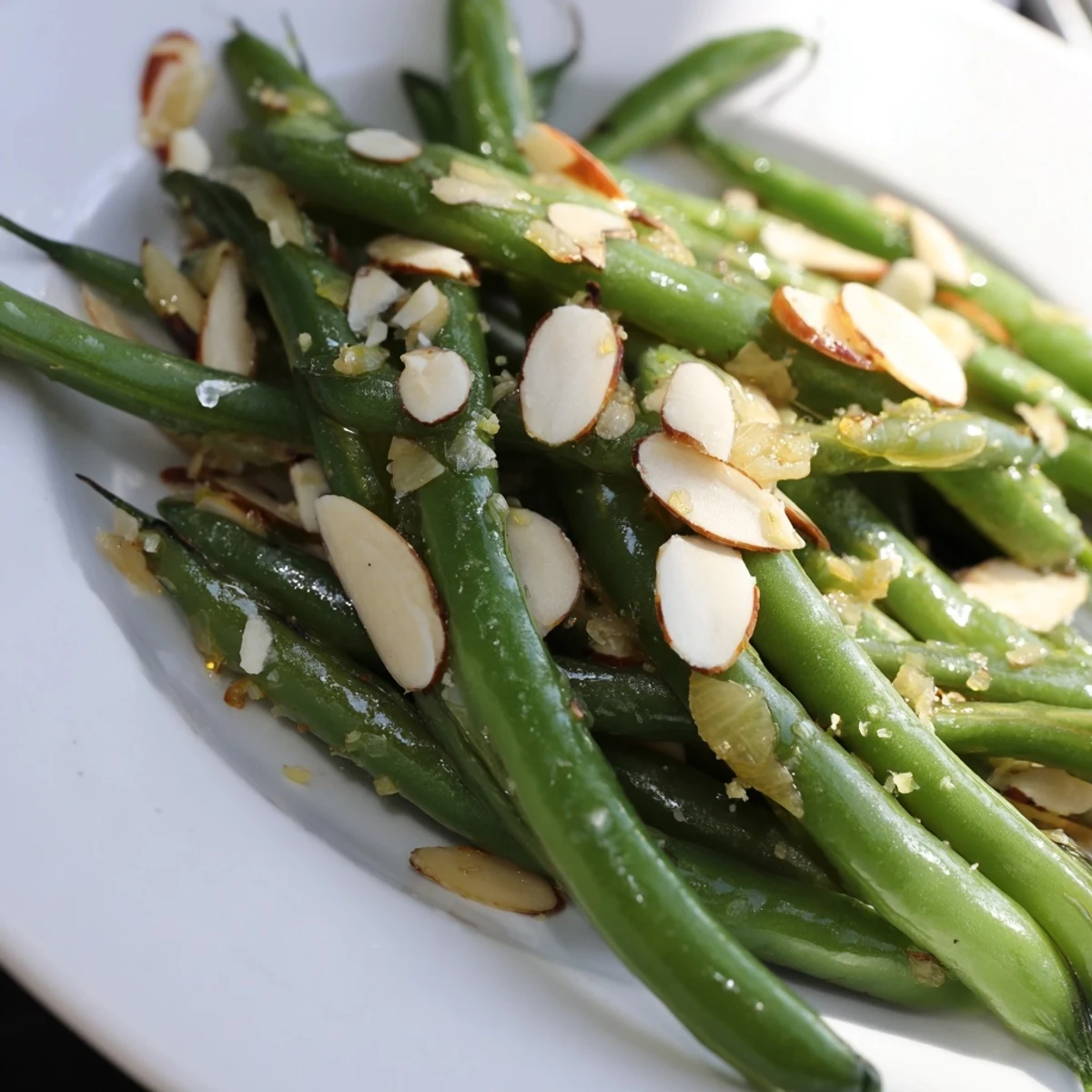 Sautéed green beans tossed with fragrant garlic and olive oil, plated as a simple gluten-free side