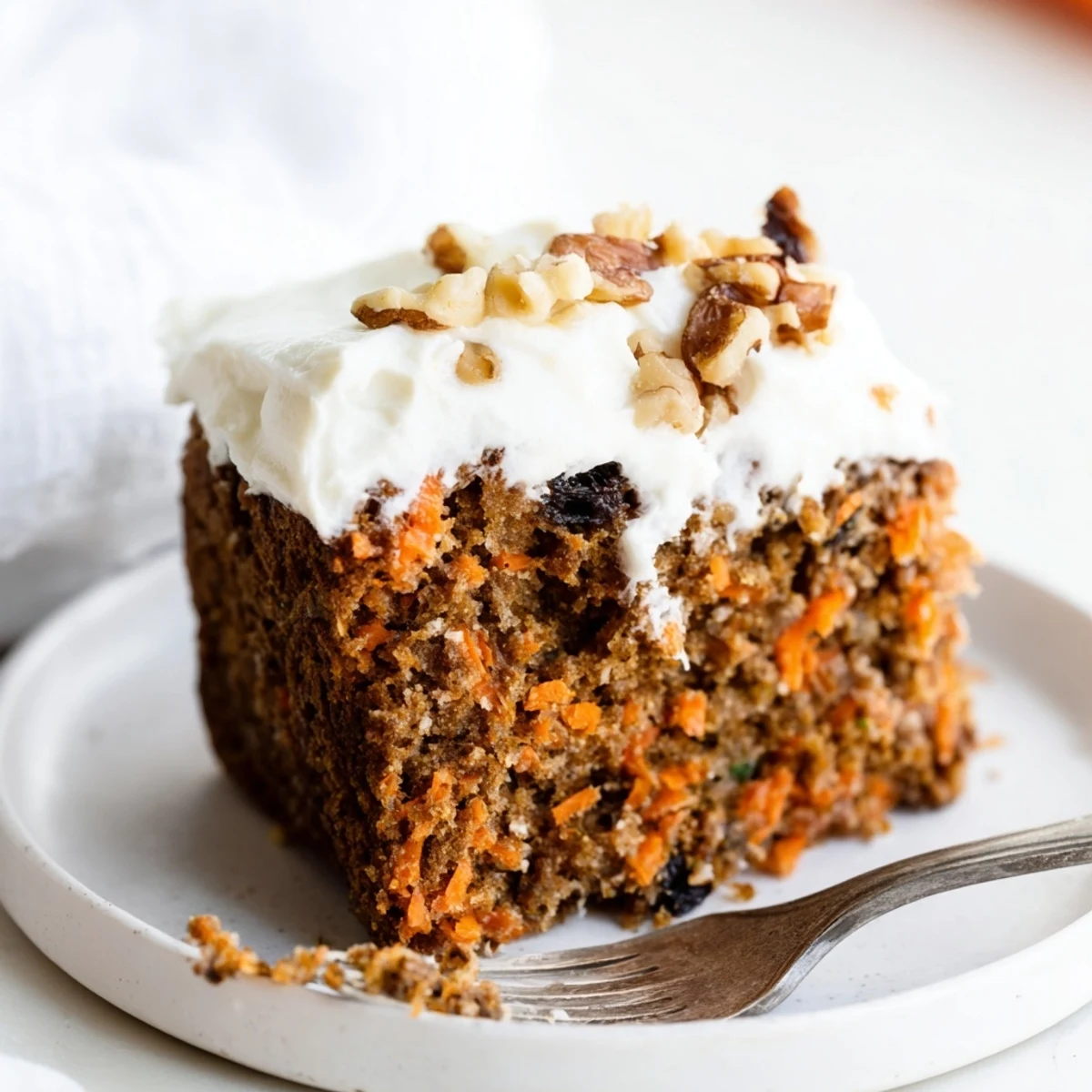 Homemade flourless oatmeal carrot cake with tender crumb and warm cinnamon spice visible