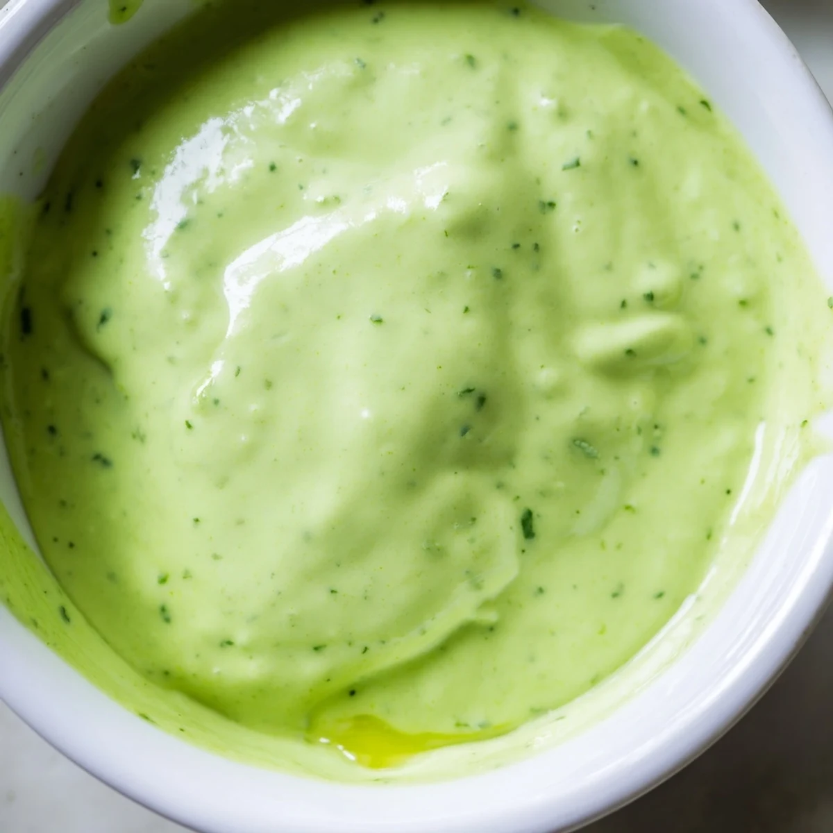 Creamy cilantro lime sauce drizzled generously over grilled chicken tacos with fresh vegetables