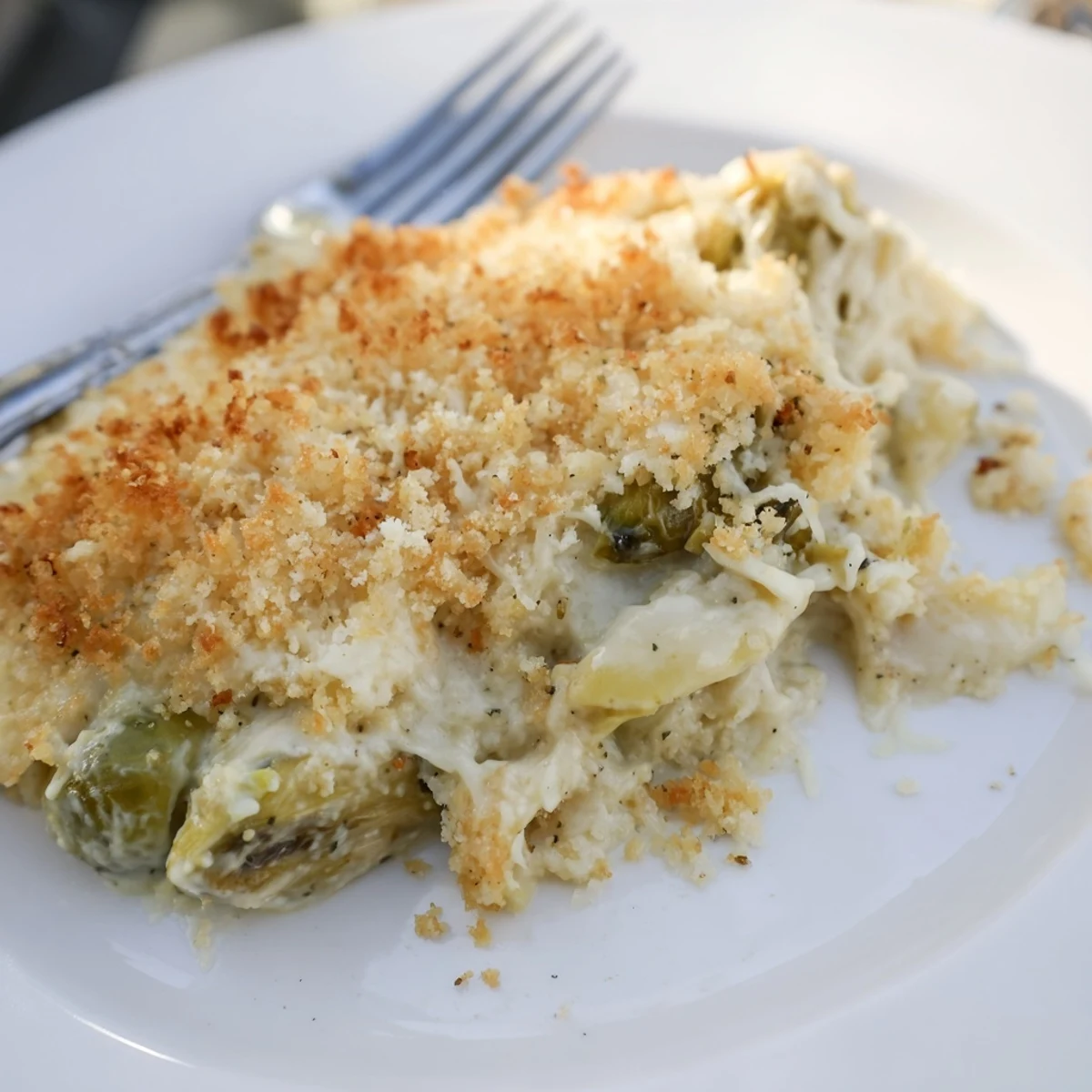 Warm Creamy Parmesan Brussels Sprouts Casserole topped with crisp panko, nutmeg-scented richness