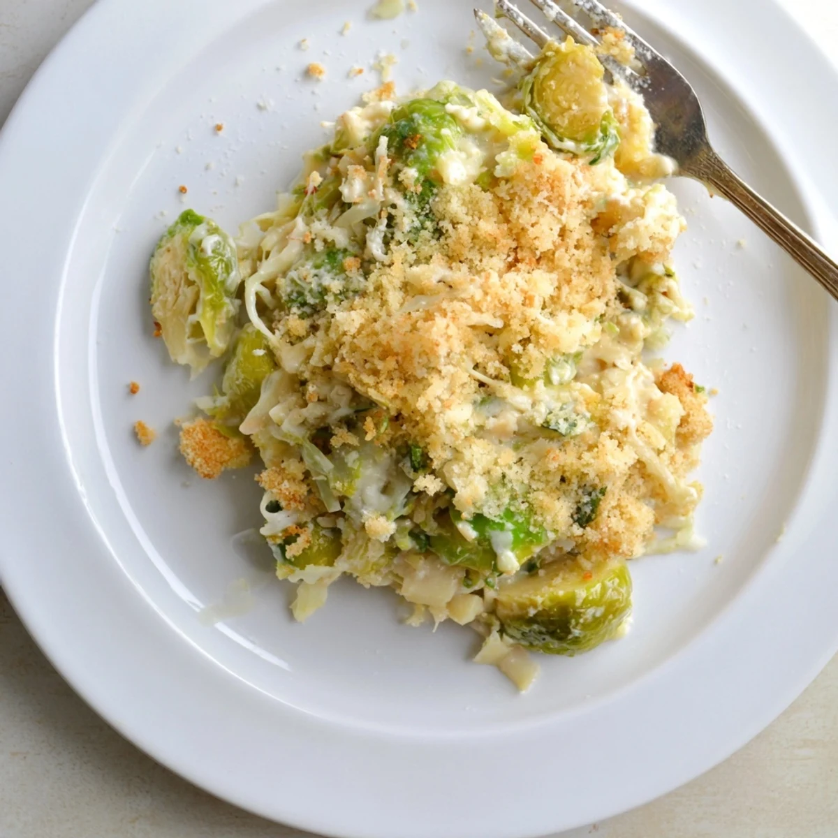 Creamy Parmesan Brussels Sprouts Casserole served warm with roasted poultry or fresh salad